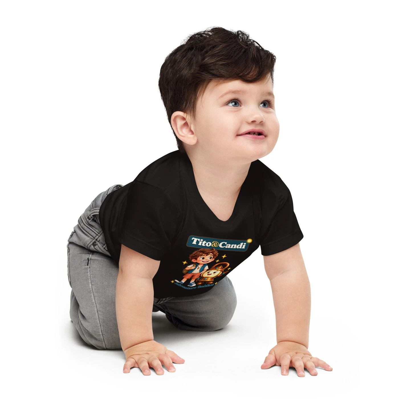Baby in a black T-shirt with Tito and Candi side by side and the words Adventure Buddies