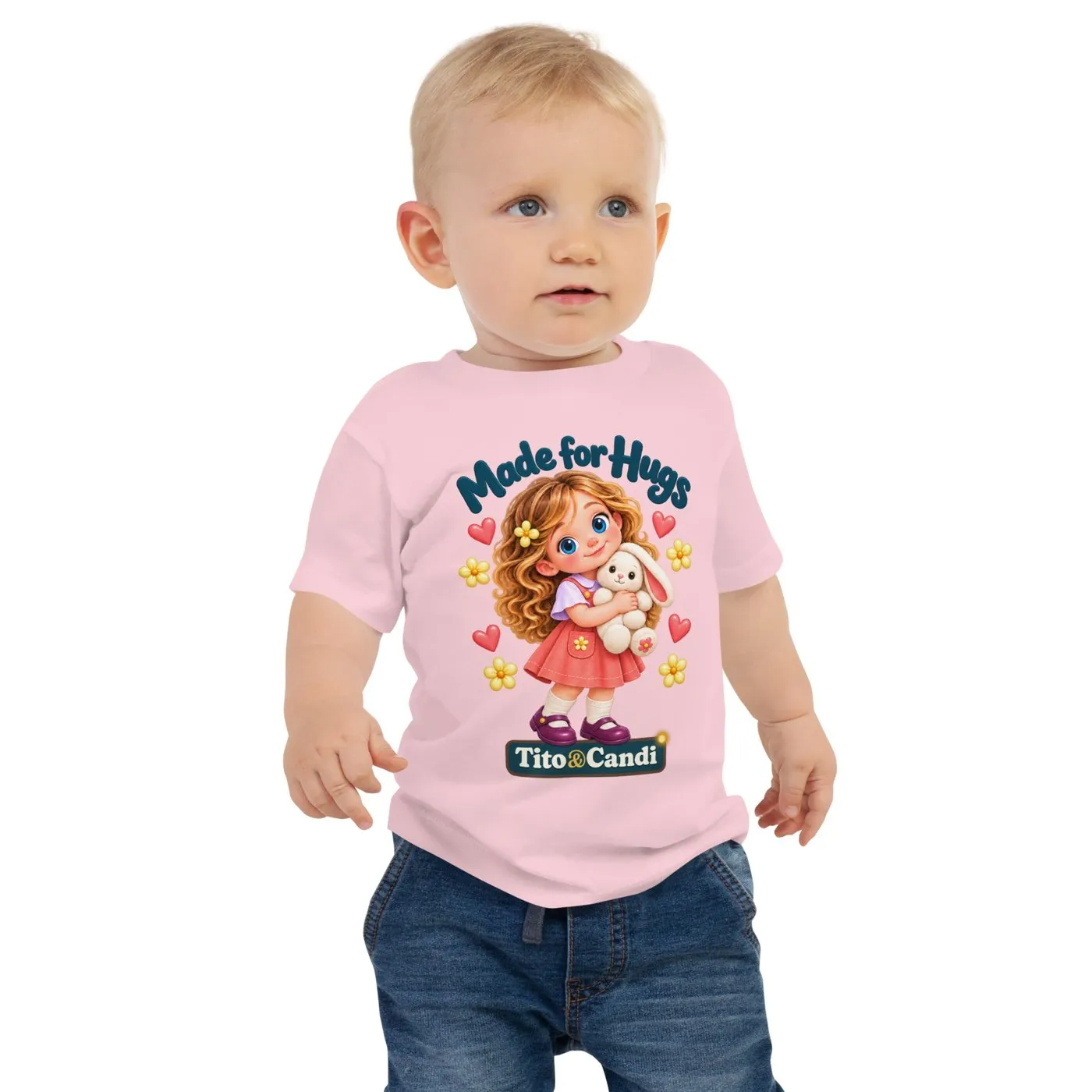 Baby in a pink T-shirt with Alice hugging her plush bunny, hearts, yellow flowers and the words Made for Hugs