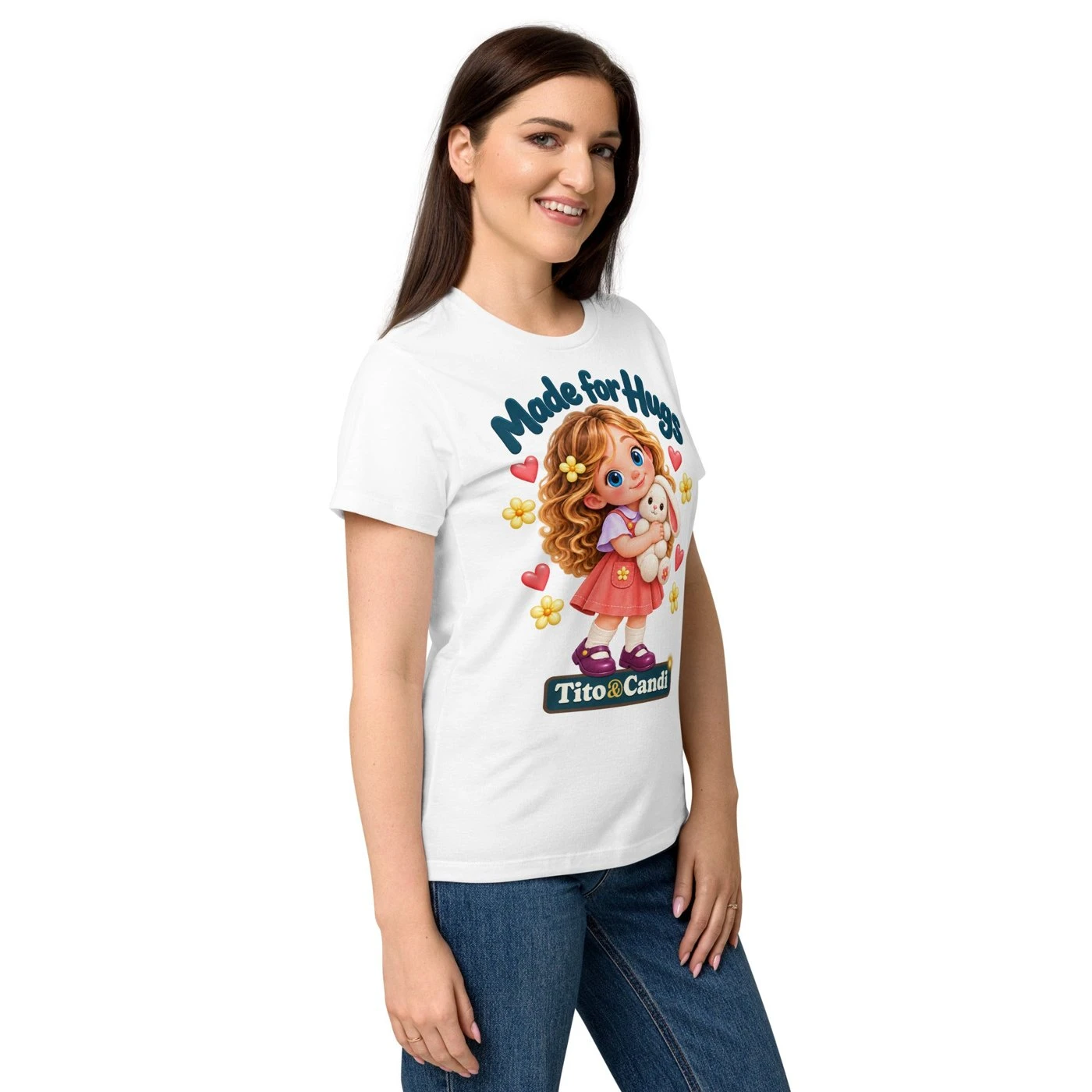 Woman in a white T-shirt with Alice hugging her plush bunny and the words Made for Hugs
