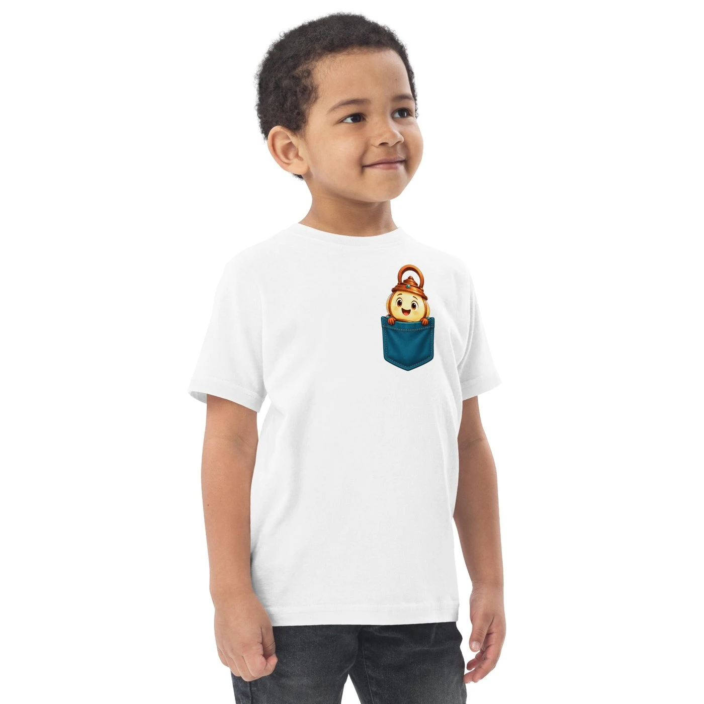 Smiling toddler in a white T-shirt with Candi peeking out of a small blue pocket