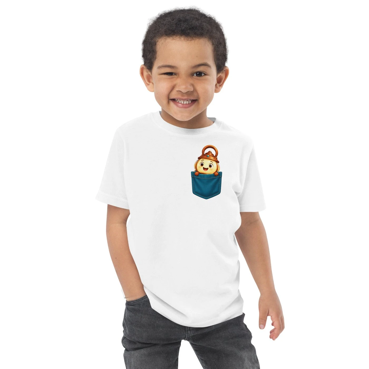Smiling toddler in a white T-shirt with Candi peeking out of a small blue pocket